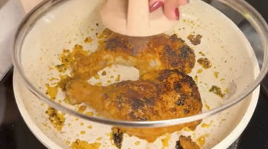 Creamy Iffa chicken coated in rich garlic cheese sauce and garnished with coriander
